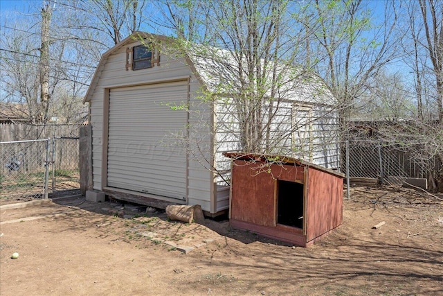 view of shed featuring fence