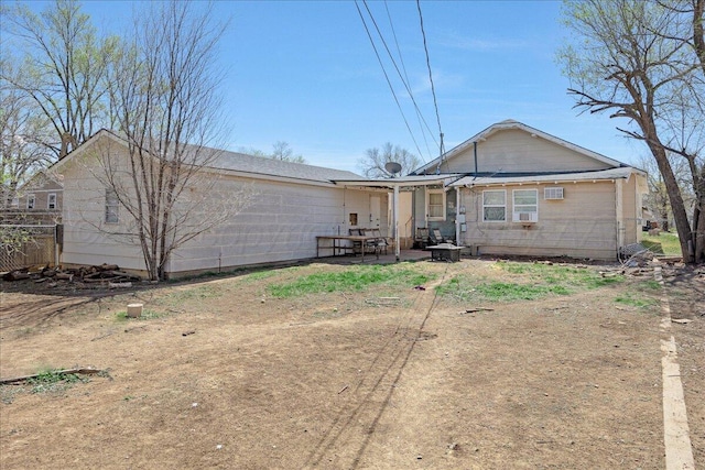 back of house with a patio