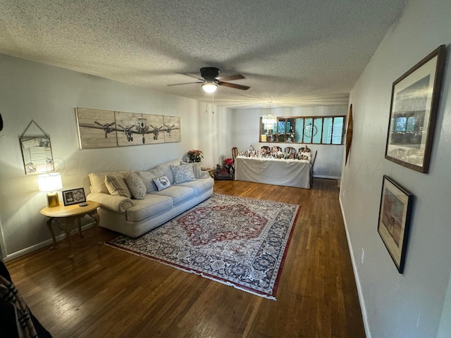 2318 Atkinsen St, Amarillo, TX 79106 - living area with wood finished floors, a ceiling fan, and a textured ceiling