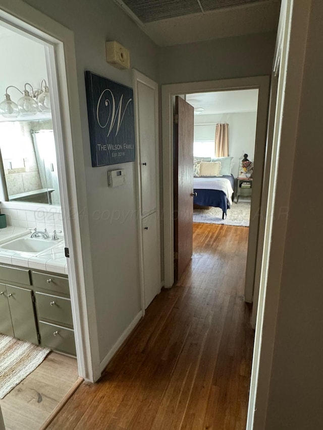 2318 Atkinsen St, Amarillo, TX 79106 - hallway featuring a sink and dark wood-style floors