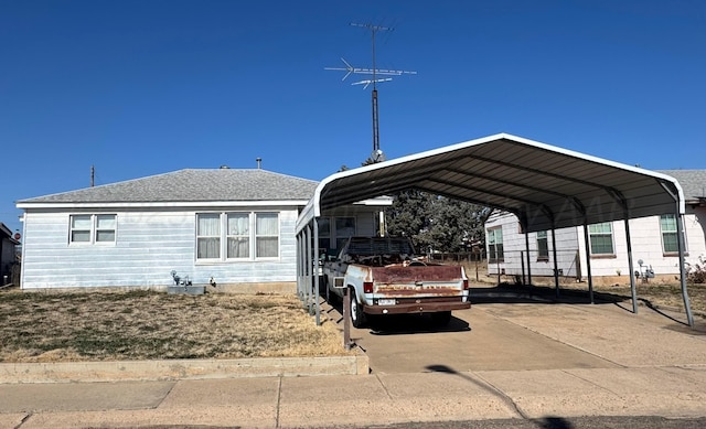 view of vehicle parking with a carport