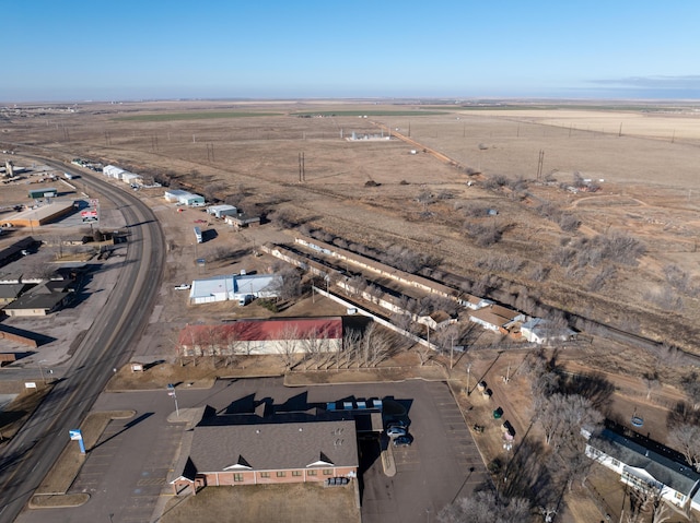 birds eye view of property with a rural view