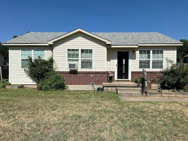 1960 S Highland St, Amarillo, TX 79103 - view of front of property featuring brick siding, a front lawn, cooling unit, and a shingled roof