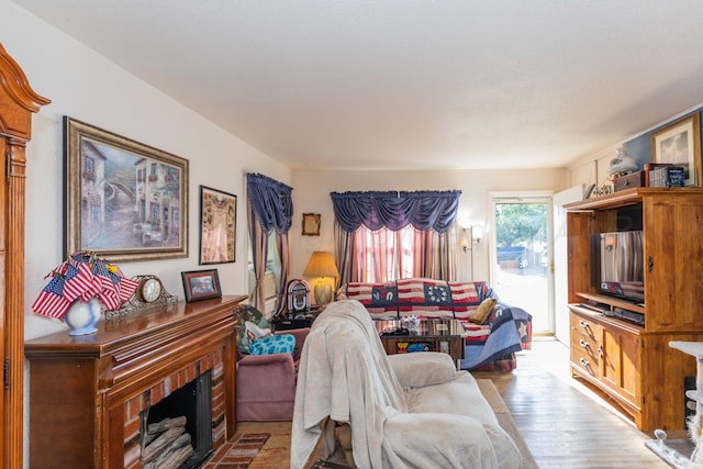 1960 S Highland St, Amarillo, TX 79103 - living room featuring a fireplace and wood finished floors