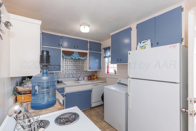 1960 S Highland St, Amarillo, TX 79103 - kitchen with white appliances, blue cabinets, washer / clothes dryer, light countertops, and tasteful backsplash