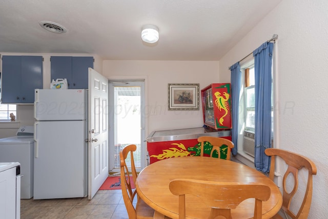 1960 S Highland St, Amarillo, TX 79103 - dining space featuring washer / dryer and light tile patterned floors