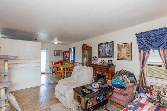 1960 S Highland St, Amarillo, TX 79103 - living room featuring wood finished floors and cooling unit