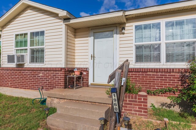 1960 S Highland St, Amarillo, TX 79103 - view of exterior entry featuring brick siding and cooling unit