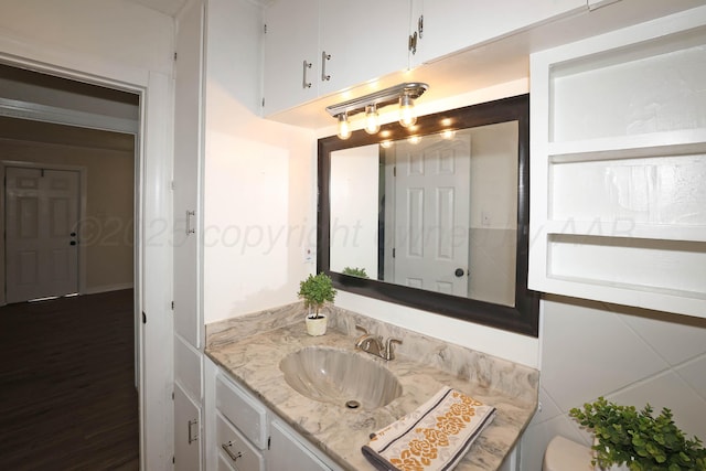 bathroom featuring toilet and vanity