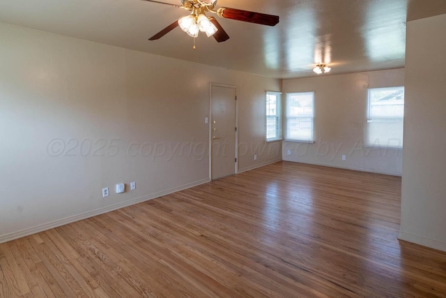 2414 Orange St, Amarillo, TX 79107 - empty room featuring wood finished floors, baseboards, and a ceiling fan