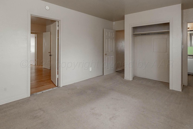 2414 Orange St, Amarillo, TX 79107 - unfurnished bedroom featuring carpet floors, a closet, and baseboards