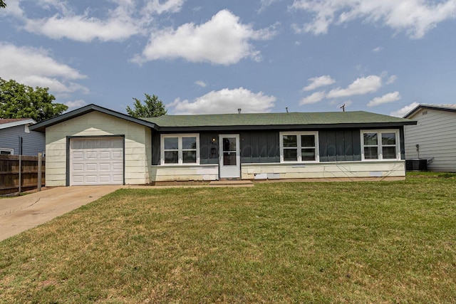 2414 Orange St, Amarillo, TX 79107 - ranch-style house with a garage, concrete driveway, board and batten siding, and central AC unit