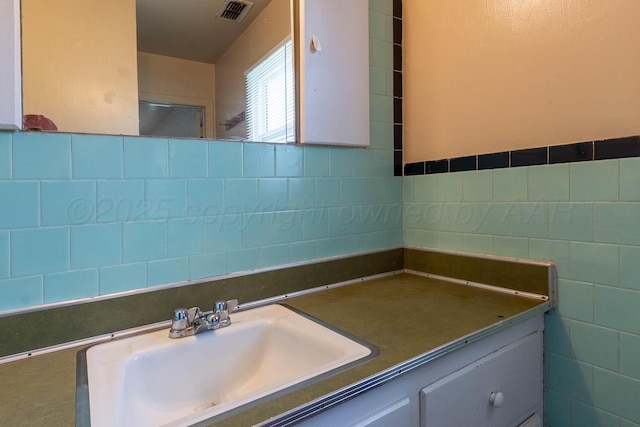 2414 Orange St, Amarillo, TX 79107 - bathroom featuring vanity and tile walls