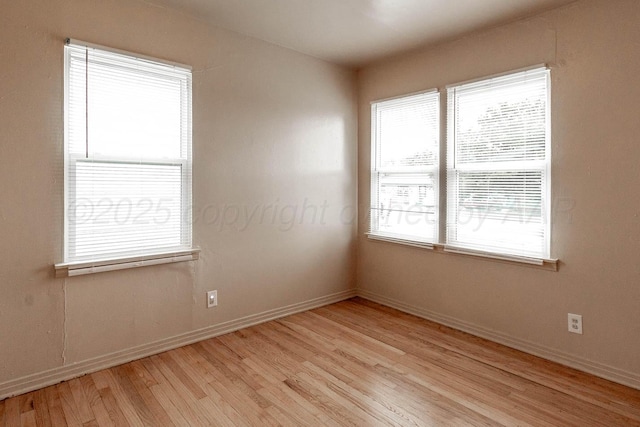 2414 Orange St, Amarillo, TX 79107 - empty room featuring light wood finished floors and baseboards