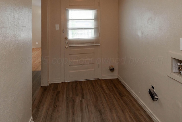 2414 Orange St, Amarillo, TX 79107 - laundry room with dark wood finished floors, baseboards, and washer hookup