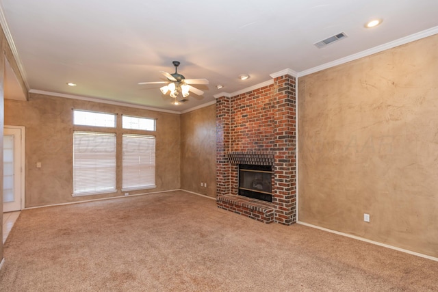 unfurnished living room with visible vents, ornamental molding, ceiling fan, and carpet floors