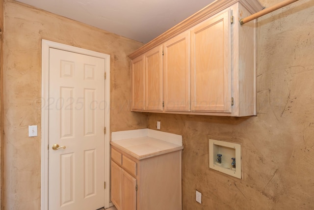 laundry area with hookup for a washing machine and cabinet space