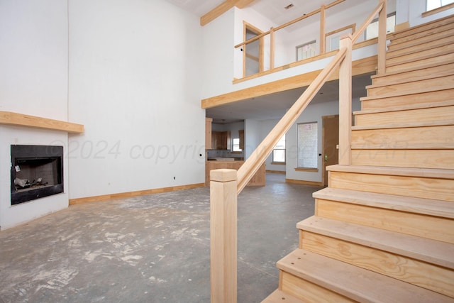 21 Barndo Dr, Amarillo, TX 79124 - stairway with a wealth of natural light, a towering ceiling, and concrete floors