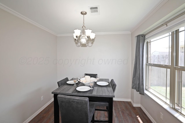 4103 San Angelo Ave, Amarillo, TX 79118 - dining area with a chandelier, baseboards, crown molding, and dark wood-style floors