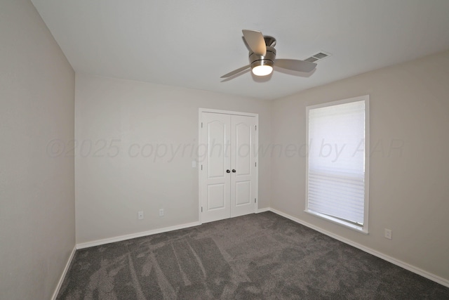 4103 San Angelo Ave, Amarillo, TX 79118 - spare room featuring dark colored carpet, a ceiling fan, and baseboards