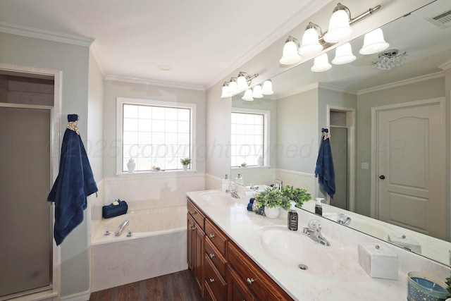 4103 San Angelo Ave, Amarillo, TX 79118 - full bathroom with double vanity, a garden tub, wood finished floors, a shower with shower door, and ornamental molding