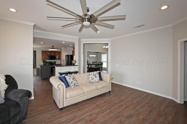 4103 San Angelo Ave, Amarillo, TX 79118 - living area featuring dark wood-style flooring, a ceiling fan, ornamental molding, recessed lighting, and baseboards
