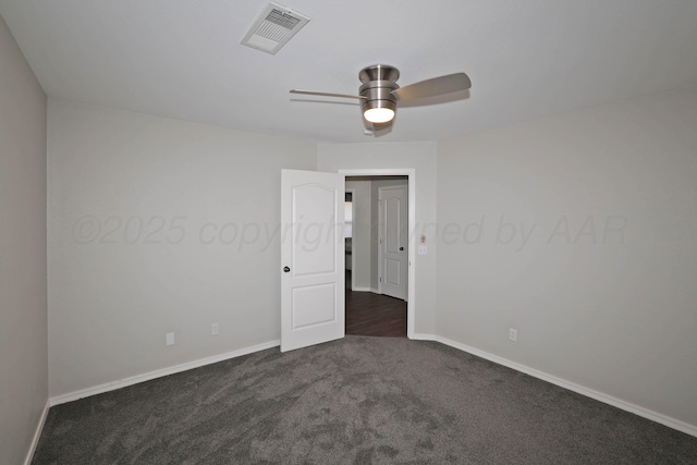 4103 San Angelo Ave, Amarillo, TX 79118 - spare room featuring a ceiling fan, dark carpet, and baseboards