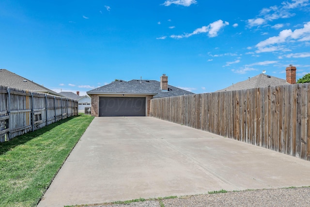 4103 San Angelo Ave, Amarillo, TX 79118 - view of yard with a garage and concrete driveway