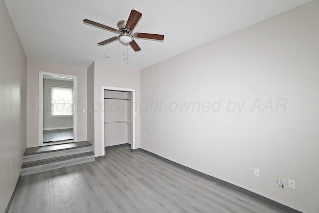 4112 S Tyler St, Amarillo, TX 79110 - unfurnished bedroom with wood finished floors, ceiling fan, and a closet