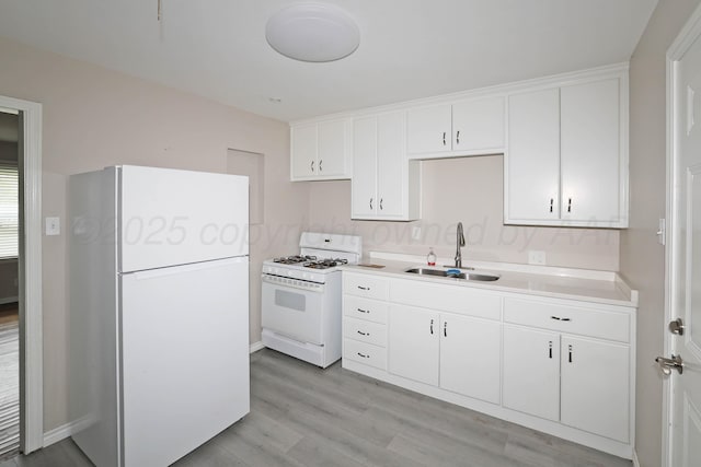 4112 S Tyler St, Amarillo, TX 79110 - kitchen featuring white appliances, light wood-style flooring, white cabinets, and light countertops