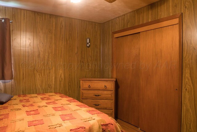 1909 N Wells St, Pampa, TX 79065 - bedroom with wooden walls and a closet