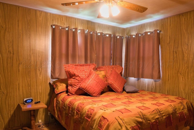 1909 N Wells St, Pampa, TX 79065 - bedroom featuring wooden walls and ceiling fan