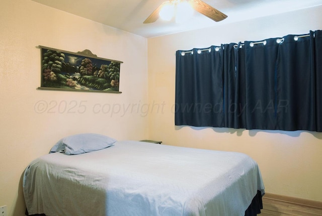 1909 N Wells St, Pampa, TX 79065 - bedroom featuring wood finished floors, ceiling fan, and baseboards