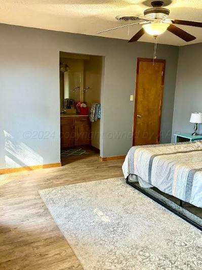 bedroom featuring a closet, ceiling fan, and hardwood / wood-style floors