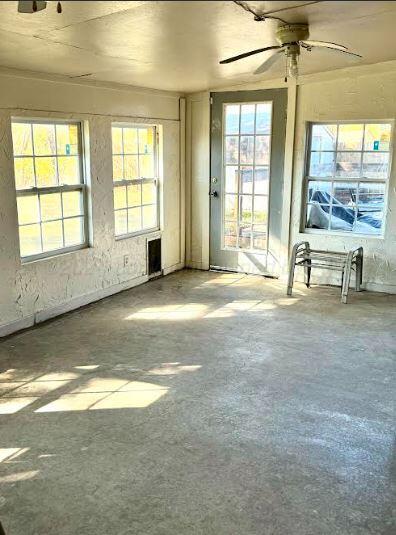 spare room featuring ceiling fan