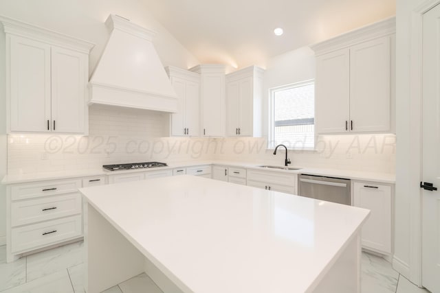 2909 Daytona Ave, Amarillo, TX 79118 - kitchen with premium range hood, light marble finish floors, appliances with stainless steel finishes, white cabinets, and recessed lighting