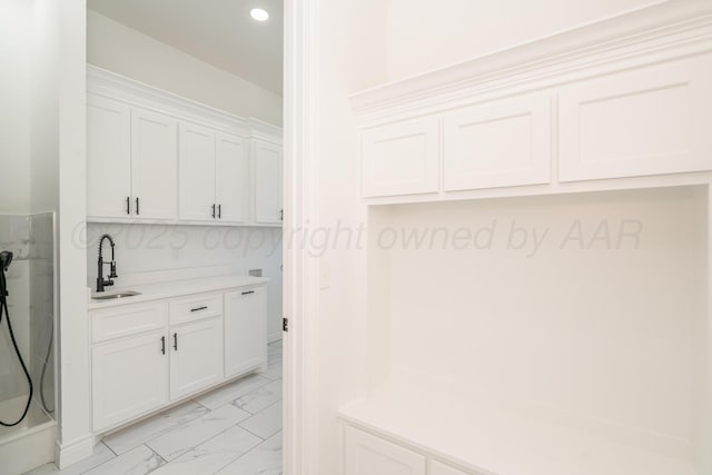 2909 Daytona Ave, Amarillo, TX 79118 - laundry area with light marble finish floors and recessed lighting