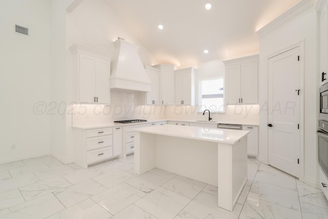 2909 Daytona Ave, Amarillo, TX 79118 - kitchen featuring custom exhaust hood, recessed lighting, light countertops, gas stovetop, and decorative backsplash
