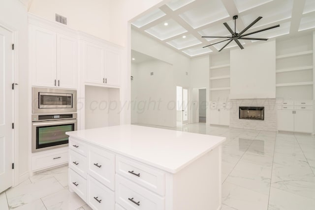 2909 Daytona Ave, Amarillo, TX 79118 - kitchen with appliances with stainless steel finishes, open floor plan, light marble finish flooring, recessed lighting, and beam ceiling