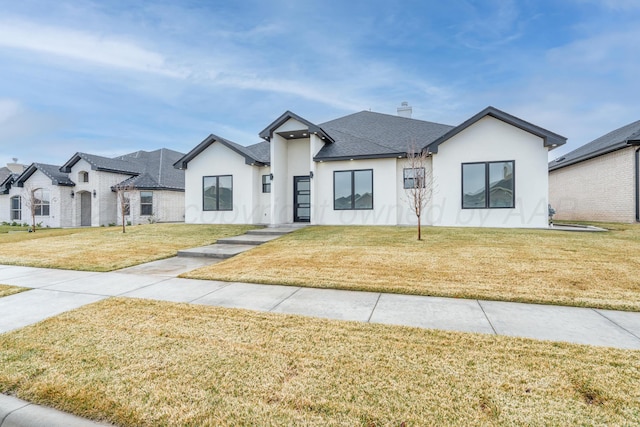 2909 Daytona Ave, Amarillo, TX 79118 - view of front of house with stucco siding, a front yard, and a chimney