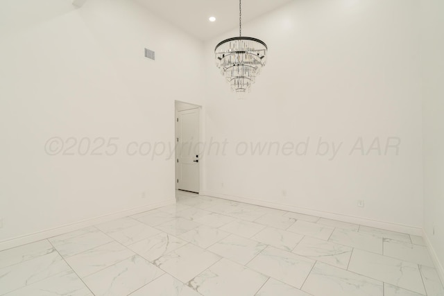 2909 Daytona Ave, Amarillo, TX 79118 - unfurnished room featuring a chandelier, light marble finish flooring, and recessed lighting