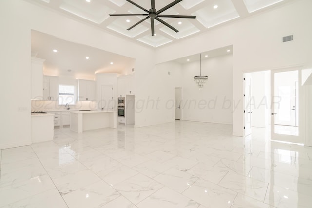2909 Daytona Ave, Amarillo, TX 79118 - unfurnished living room featuring a high ceiling, coffered ceiling, beamed ceiling, recessed lighting, and ceiling fan