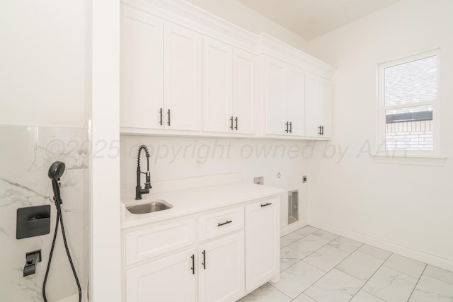 2909 Daytona Ave, Amarillo, TX 79118 - washroom featuring light marble finish flooring, cabinet space, hookup for an electric dryer, and hookup for a washing machine