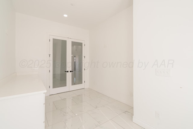 2909 Daytona Ave, Amarillo, TX 79118 - unfurnished room featuring french doors, recessed lighting, and light marble finish flooring