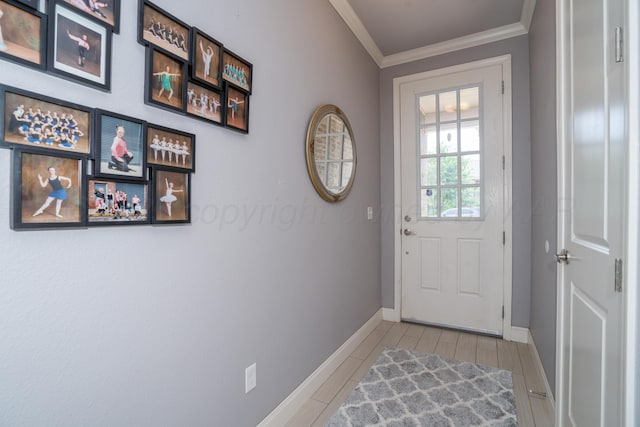 doorway featuring crown molding, baseboards, and tile patterned floors