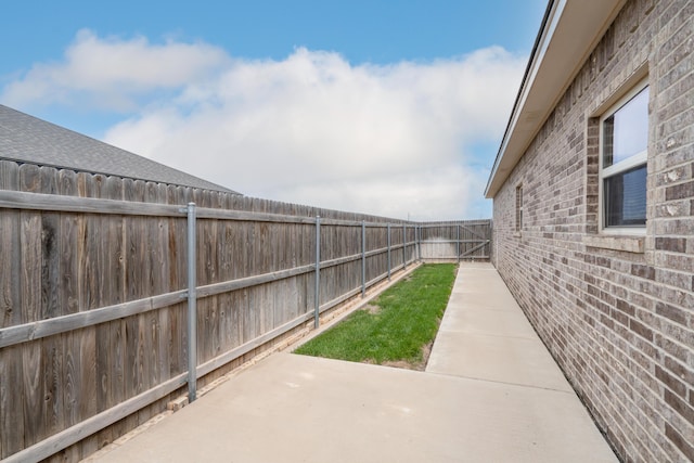 view of yard with a fenced backyard and a patio area
