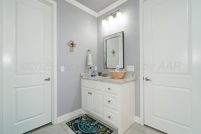 bathroom featuring baseboards, crown molding, tile patterned floors, and vanity
