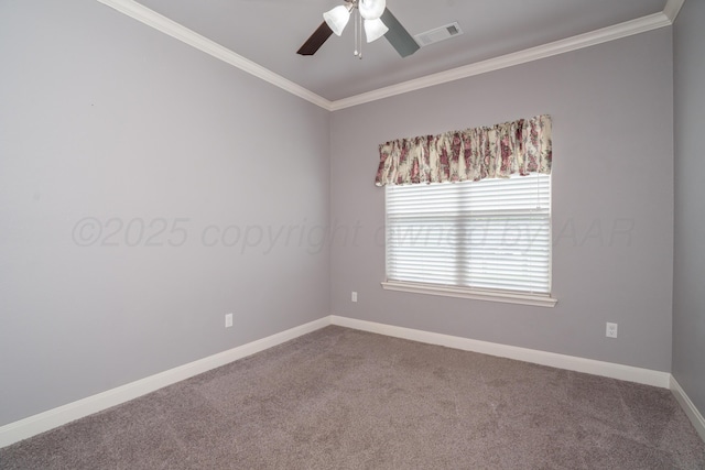 empty room with visible vents, ornamental molding, baseboards, dark colored carpet, and ceiling fan
