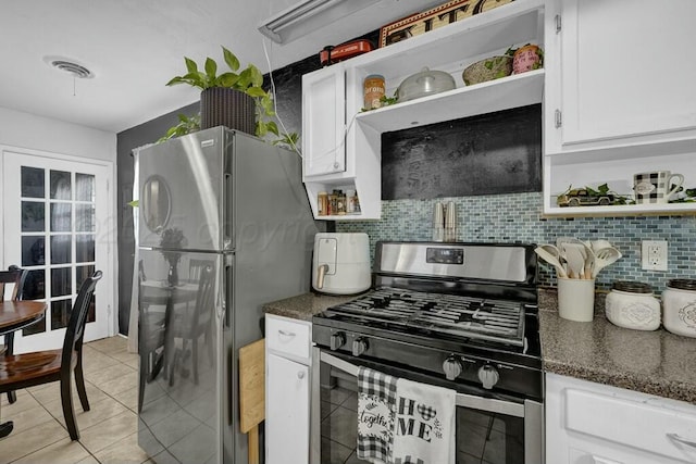 kitchen with open shelves, appliances with stainless steel finishes, visible vents, and white cabinetry