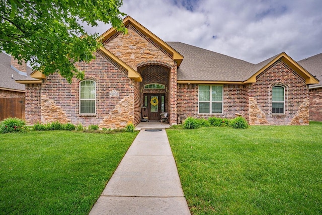 6004 Glenwood Dr, Amarillo, TX 79119 - view of front of house featuring brick siding, a shingled roof, and stone siding